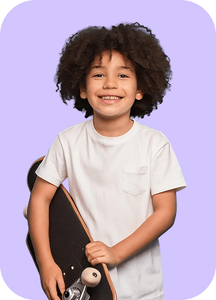 Happy child holding a skateboard